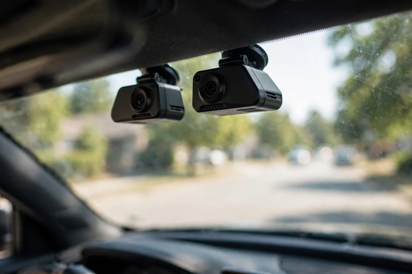 Viofo A229 Plus and Pro dash cams mounted side by side on a car windshield